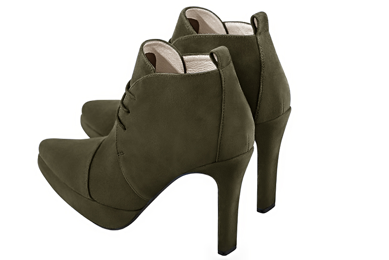 Khaki green women's ankle boots with laces at the front. Tapered toe. Very high slim heel with a platform at the front. Rear view - Florence KOOIJMAN